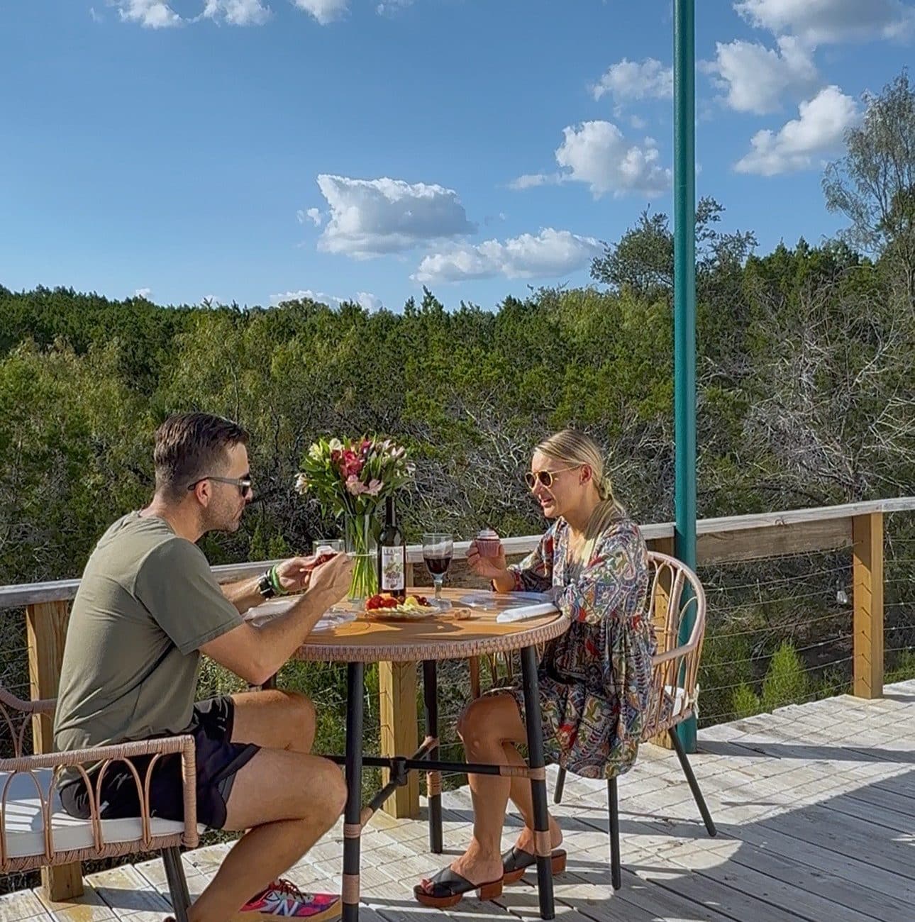 Guests enjoying an outdoor meal on a private dome deck in the Texas Hill Country.
